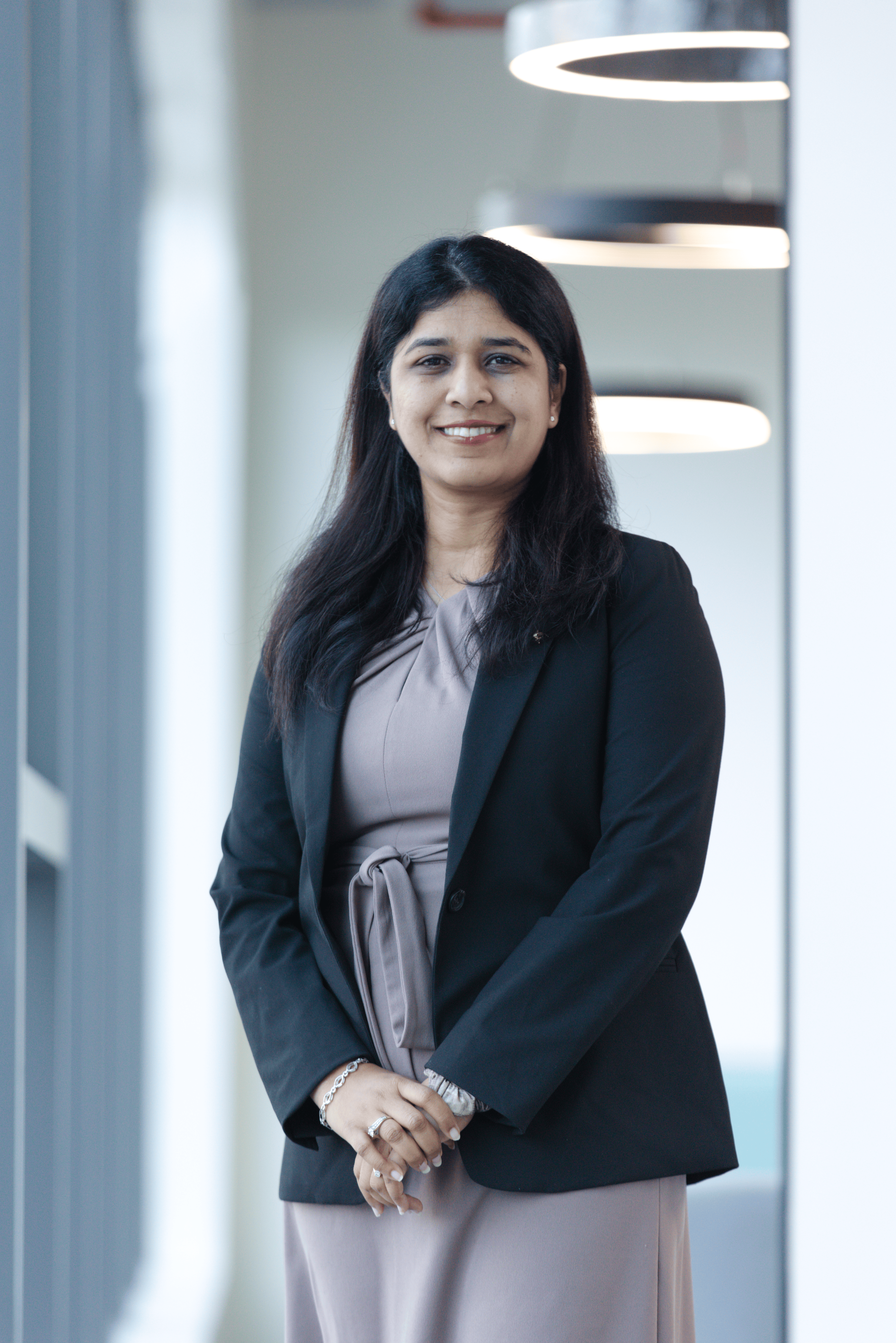 Angela Paulmony, Global HR Head, Techwave seen posing for a photo with a bright smile on her face